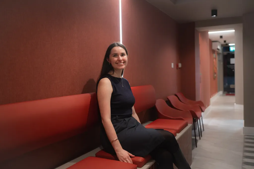 A smiling patient in the Pearly Whites waiting area