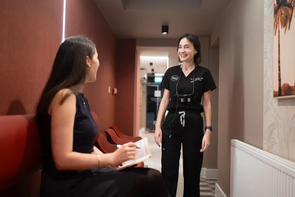 Dr Lia greeting a patient in the waiting area