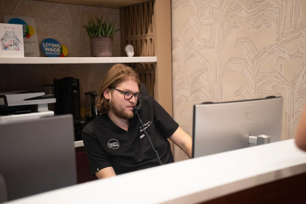 Grant Goodstein at the Pearly Whites reception desk