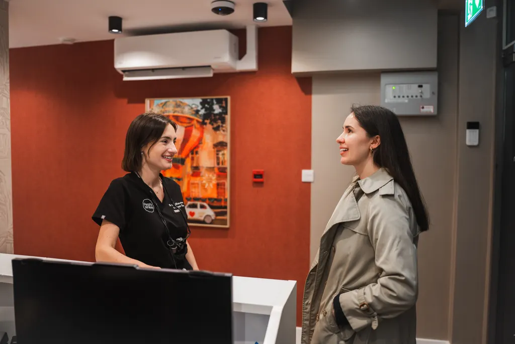 A patient being greeted at the Pearly Whites reception