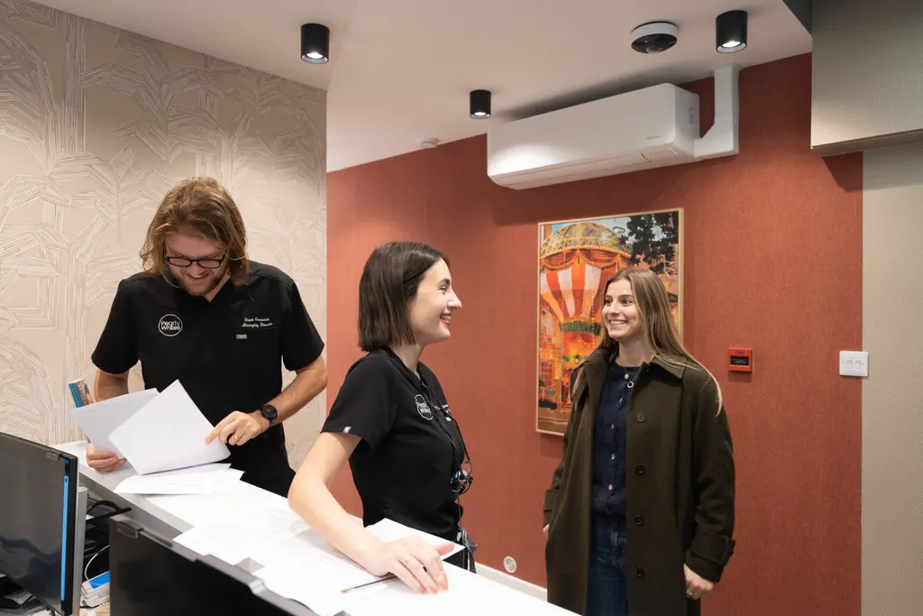 Dr Lia and Grant with patients at the Pearly Whites reception