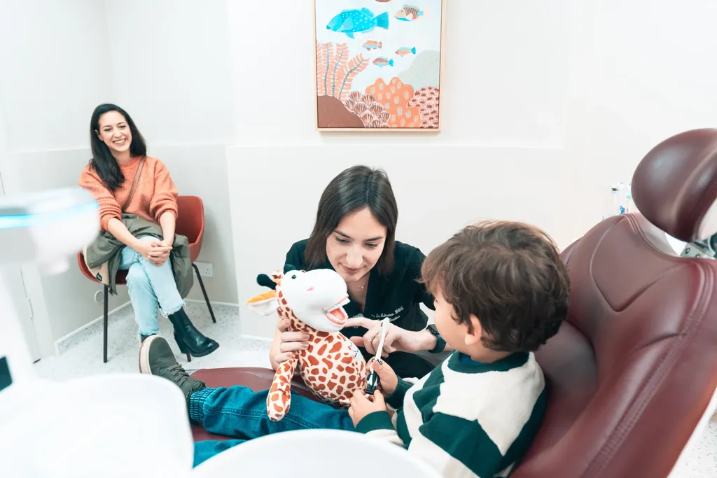 Dr Lia with a young patient and his mum during a relaxed appointment