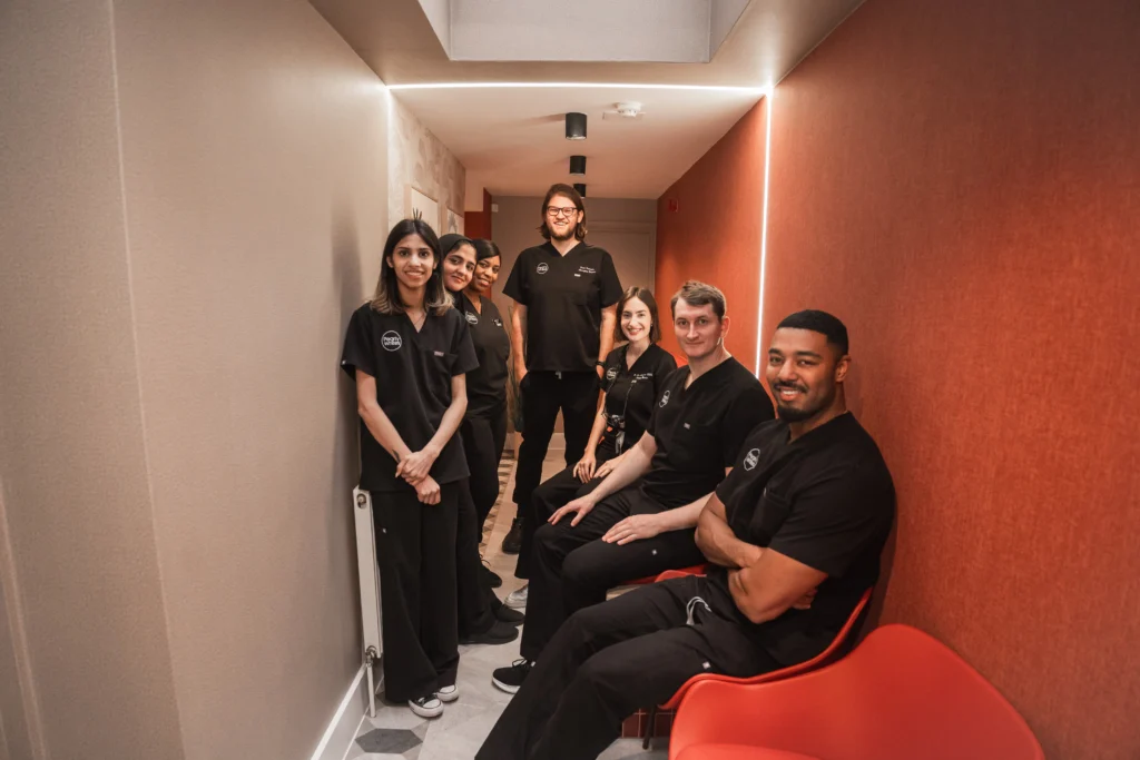 The Pearly Whites team in the practice corridor